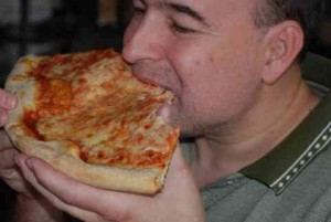 Photo by Zeke Humek of Brian Humek Eating Pizza